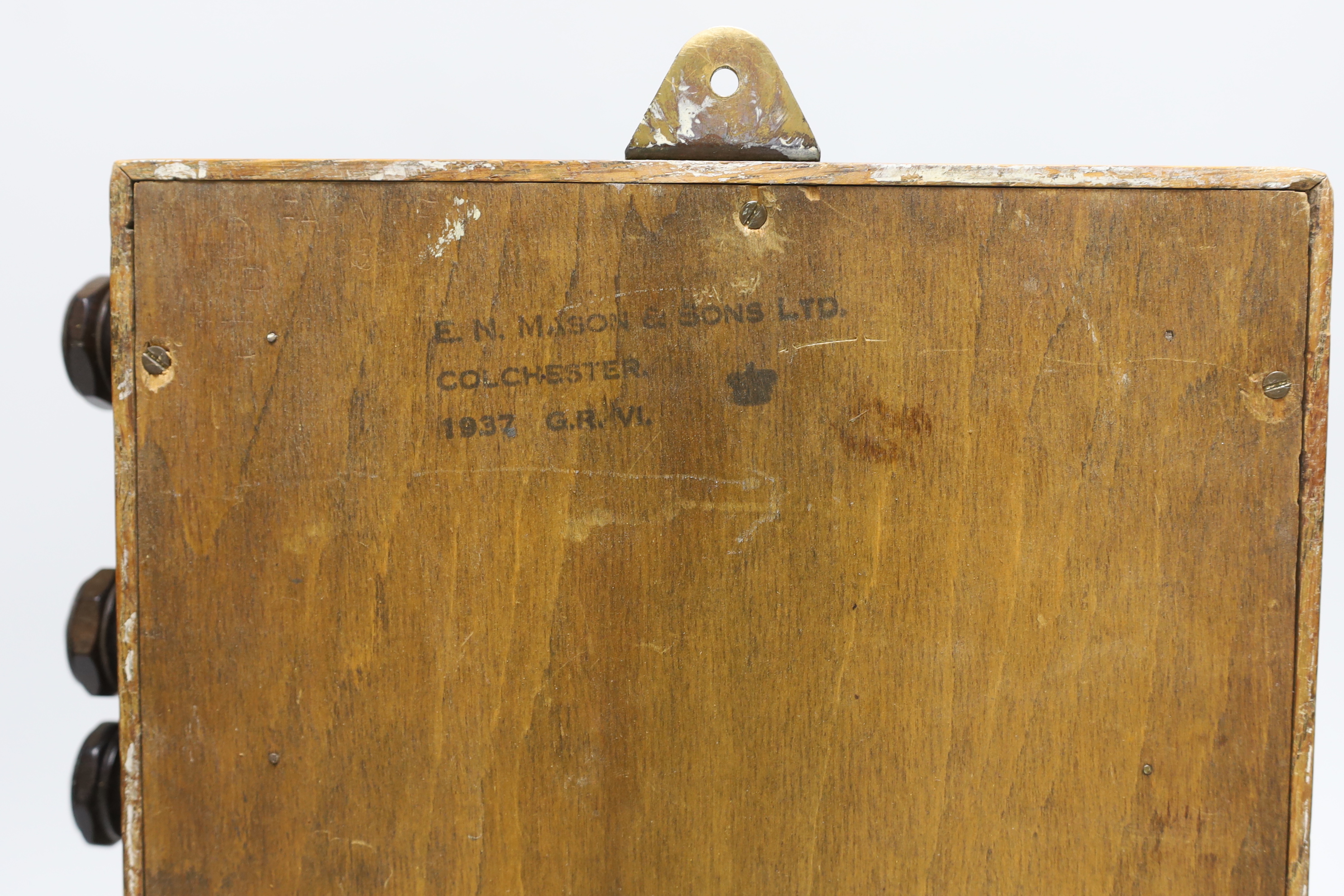 An oak desk calendar and a cast iron ‘leaf’ thermometer, 39cm